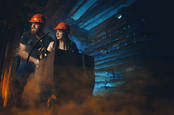 Two miners (cosplay) carrying coal up mine shaft - 