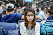 woman waits at airport