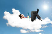 man relaxes on cloud