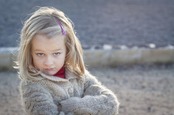 Little girl looks at camera with an I told you soattitude. 