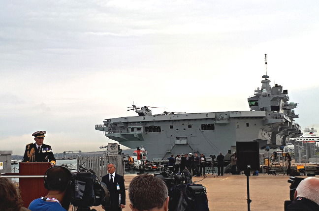 Admiral Sir Philip Jones, First Sea Lord, gives a speech in front of HMS Queen Elizabeth in Portsmouth. Pic: Gareth Corfield