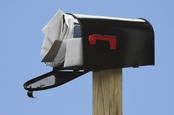 Image of an overstuffed mail box